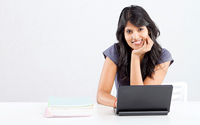 Confident Young Woman Using A Computer