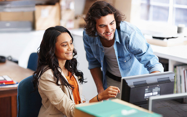 Students working together on computer